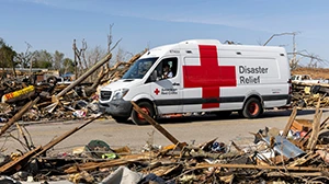 Red Cross volunteer Terry Smith drives an emergency response vehicle on Tuesday to deliver warm meals to residents in Rolling Fork., Miss. As many as 2,000 homes across Mississippi sustained major damage or were destroyed on Friday, according to early estimates. Many nearby residents were without power on Tuesday.