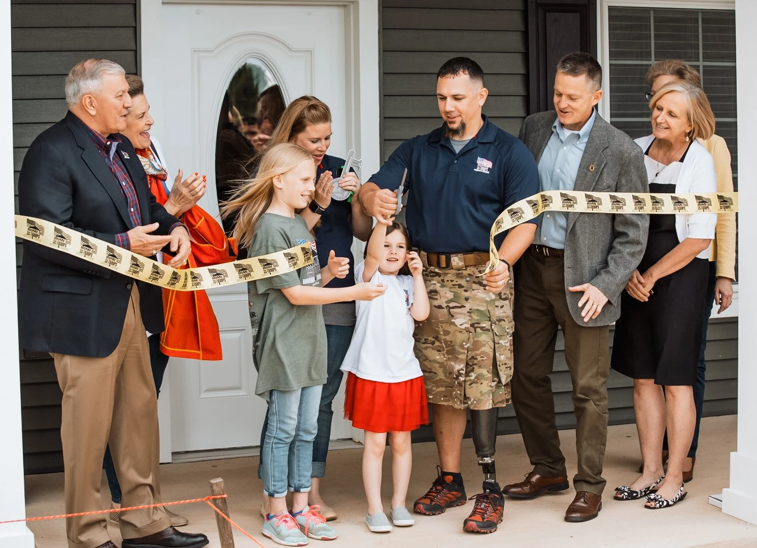 Homes For Our Troops ribbon-cutting ceremony for Army Sgt. Steven Curry 's specially adapted custom home. Photo courtesy of HFOT. 